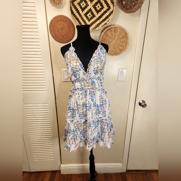 LAST ONE! Blue And White Floral Mini Dress With Ruffles And Criss-Cross Back - Picture 2 of 11